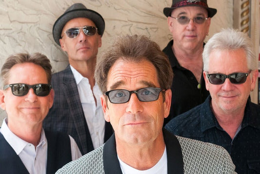NOW BOOKING HUEY LEWIS AND THE NEWS